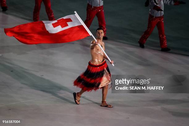 Tonga's flagbearer Pita Taufatofua leads his country's delegation during the opening ceremony of the Pyeongchang 2018 Winter Olympic Games at the...