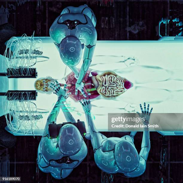 robots operating on organs of transparent android - healthcare and medicine from above stock pictures, royalty-free photos & images