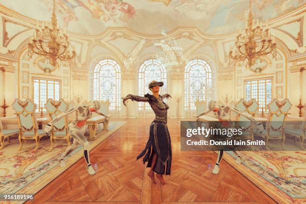 woman wearing virtual reality goggles dancing in ballroom - augmented-reality stock-fotos und bilder