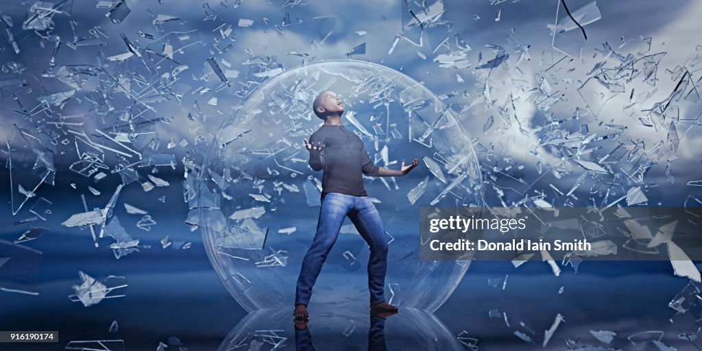 Man standing in sphere protected from falling shards of glass