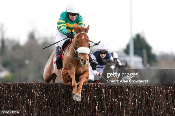 Barry Geraghty riding Modus clear the last to win The Matchbook VIP Graduation Steeple Chase at Kempton Park racecourse on February 9, 2018 in...