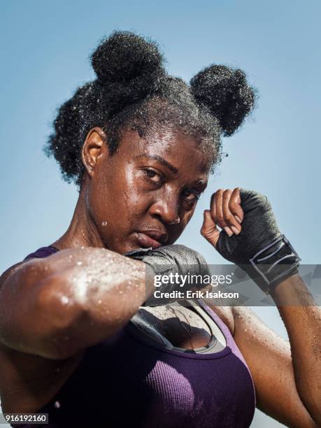 portrait of black woman with hands wrapped for boxing - african american women wet stock-fotos und bilder