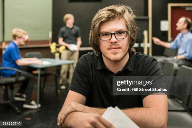 portrait of student holding script in theater class - actors studio foto e immagini stock
