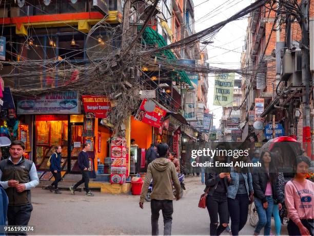 thamel area in kathmandu, nepal - february 25, 2017 - thamel stock pictures, royalty-free photos & images