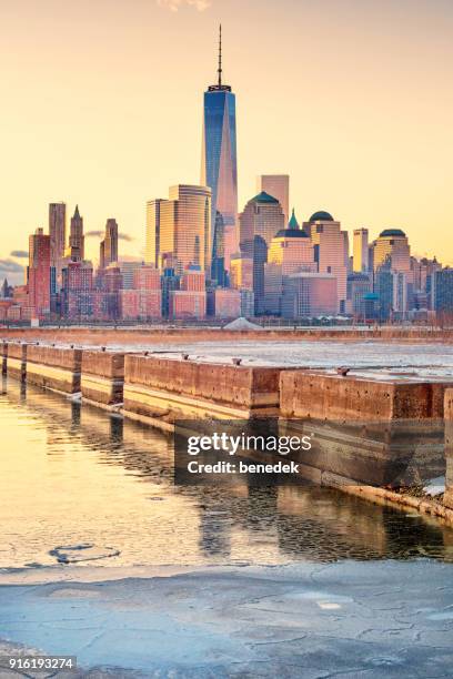 skyline of manhattan new york city as seen from newport jersey city during sunrise - newport jersey city stock pictures, royalty-free photos & images