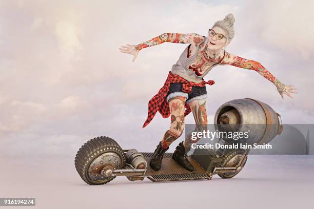 older woman with tattoos riding futuristic skateboard - futuristic tattoos stockfoto's en -beelden