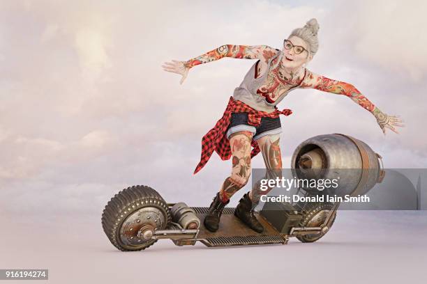 older woman with tattoos riding futuristic skateboard - anti ageing stockfoto's en -beelden