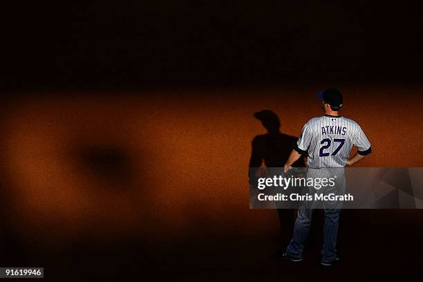 Garrett Atkins of the Colorado Rockies stands in the field against the Philadelphia Phillies in Game Two of the NLDS during the 2009 MLB Playoffs at...