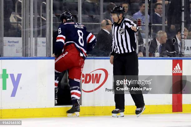 Cody McLeod of the New York Rangers exits the game after getting into a fist fight with Adam McQuaid of the Boston Bruins in the first period during...