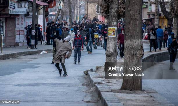 Kashmiri Muslims protest throw bricks and stones at Indian government forces as they withdraw from the restriction bound areas in the old city while...