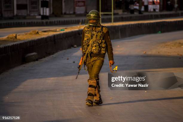 An Indian paramilitary trooper stands guard, in the Old City during restrictions on the fifth death anniversary of Afzal Guru on February 09, 2018 in...