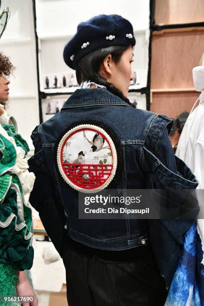 Model poses backstage for the Just In XX - Presentation at Gallery II at Spring Studios on February 9, 2018 in New York City.