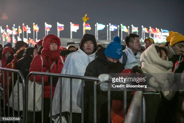 Attendees leave the PyeongChang Olympic Plaza following the opening ceremony at the 2018 PyeongChang Winter Olympic Games in the Hoenggye-ri village...