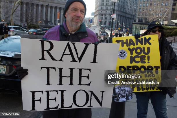 Two counter protestors at a New Sanctuary movement march in a weekly protest against immigrant deportations call for the arrest of Ravi Ragbir on...