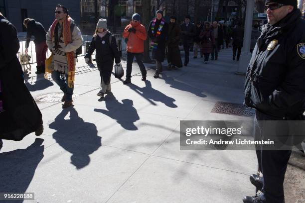 New Sanctuary movement activists march in a weekly protest against immigrant deportations on February 8, 2018 outside of immigration court at 26...