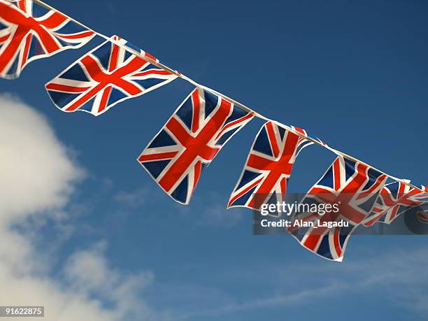 british flags and bunting decoration in jersey - bunting stockfoto's en -beelden