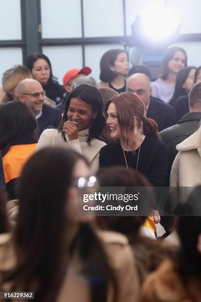 Liya Kebede and Julianne Moore attend the Tory Burch Fall Winter 2018 Fashion Show during New York Fashion Week at Bridge Market on February 9, 2018...