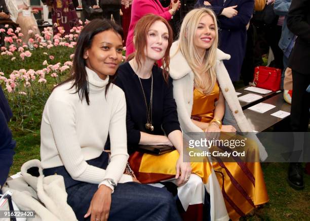 Liya Kebede, Julianne Moore, and Sienna Miller attend the Tory Burch Fall Winter 2018 Fashion Show during New York Fashion Week at Bridge Market on...