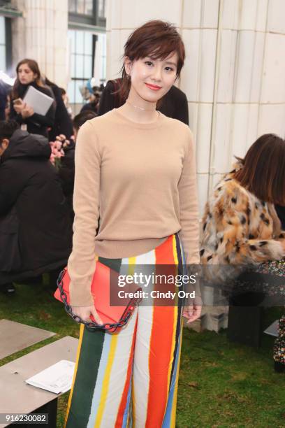 Actor Liu Shishi attends the Tory Burch Fall Winter 2018 Fashion Show during New York Fashion Week at Bridge Market on February 9, 2018 in New York...