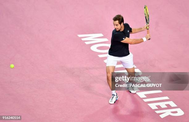 France's Richard Gasquet returns the ball to Bosnia's Damir Dzumhur during their quarter-final singles tennis match at the Open Sud de France ATP...