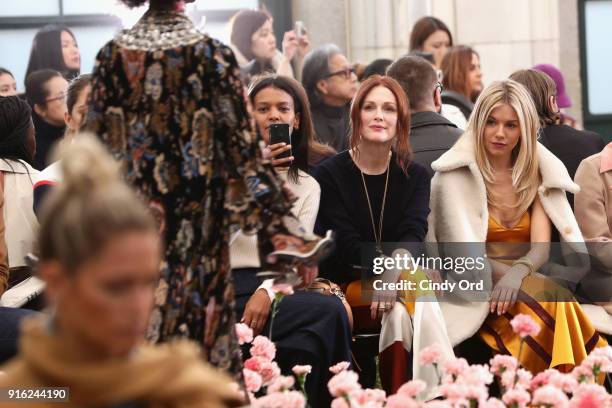 Liya Kebede, Julianne Moore, and Sienna Miller attend the Tory Burch Fall Winter 2018 Fashion Show during New York Fashion Week at Bridge Market on...