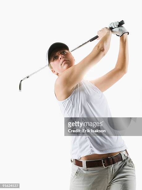 a golfer - woman studio shot stock pictures, royalty-free photos & images