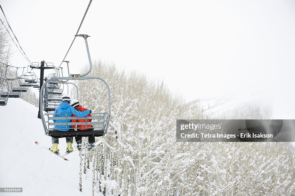 Skiers on a ski lift