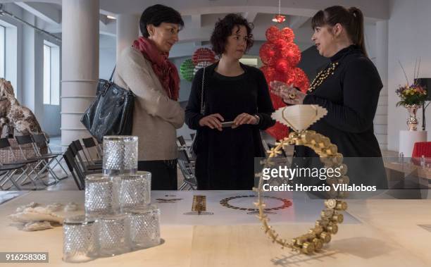 Portuguese artist Joana Vasconcelos talks to journalists in front of scale models of some of her works during the press conference announcing her...