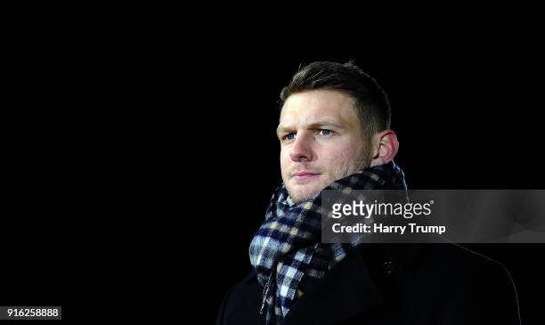 Dan Biggar of Wales and Ospreys looks on as he is interviewed by BT Sport during the Aviva Premiership match between Bath Rugby and Northampton...