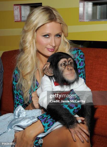 Paris Hilton with Bentley the Chimpanzee attends the opening of Carnival at Bowlmor Lanes on October 8, 2009 in New York City.