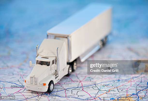 a toy truck on a map - toy truck stock pictures, royalty-free photos & images