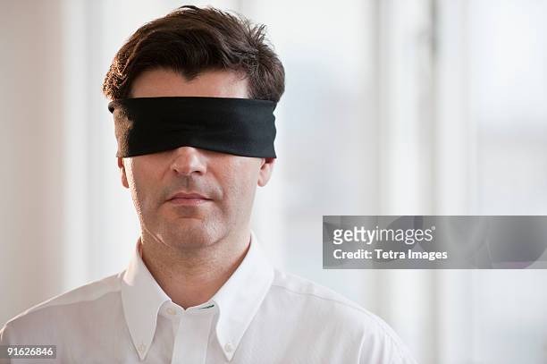 businessman wearing blindfold - 目隠し ストックフォトと画像