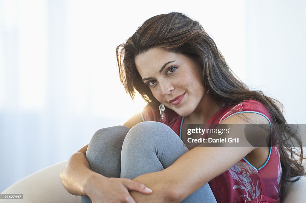 A woman sitting in living room