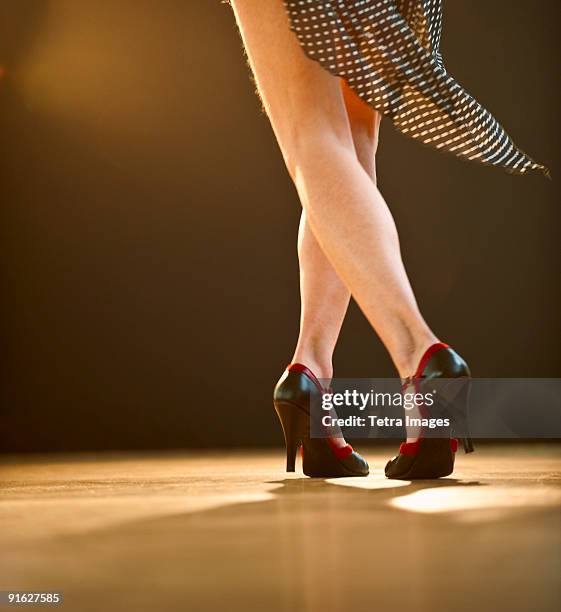 a woman dancing - latin american dancing stock pictures, royalty-free photos & images