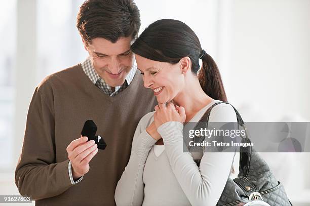 a couple looking at engagement rings - jewellery box stock pictures, royalty-free photos & images