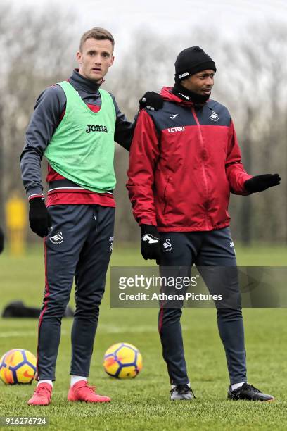 Andy King and Andre Ayew chat during the Swansea City Training and Press Conference at The Fairwood Training Ground on February 08, 2017 in Swansea,...