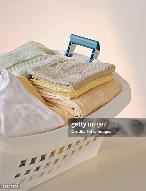 a laundry basket full of clothes - empty laundry basket stock pictures, royalty-free photos & images