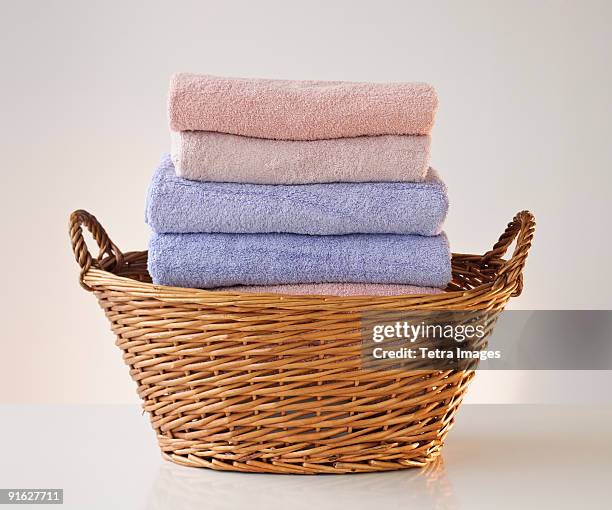 a laundry basket full of towels - hamper stock pictures, royalty-free photos & images