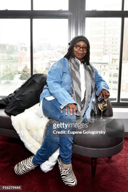 Actor Whoopi Goldberg drinks Badoit water in the Etihad VIP Lounge during IMG NYFW: The Shows at Spring Studios on February 9, 2018 in New York City.