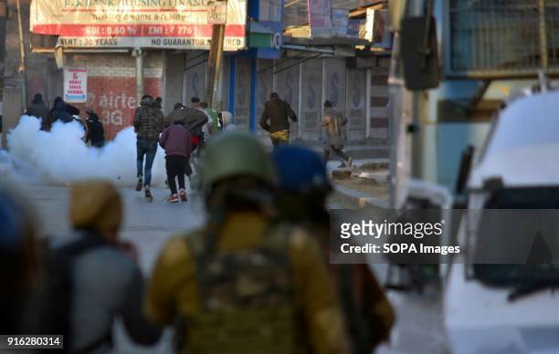 Tear gas shell fired by Indian forces explode near Kashmiri protesters during clashes in Srinagar, Indian administered Kashmir. Indian forces fired...