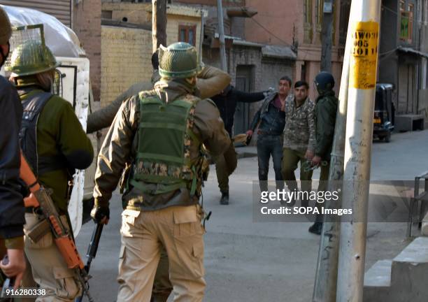 Indian policemen detain a Kashmiri protester during clashes in Srinagar, Indian administered Kashmir. Indian forces fired teargas to disperse...