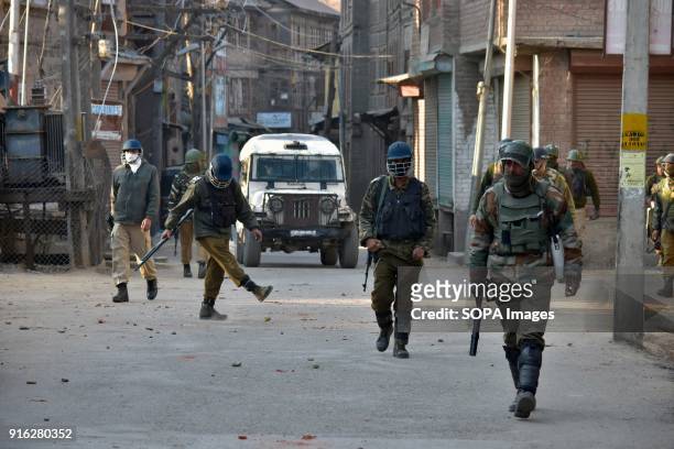 Personnel during a clash in Srinagar, Indian administered Kashmir. Indian forces fired teargas to disperse protesters on Friday during a strike...
