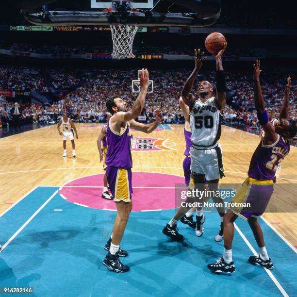 David Robinson of the San Antonio Spurs shoots during Game Two of the Second Round of the 1995 NBA Playoffs played on May 16, 1995 at the Alamo Dome...