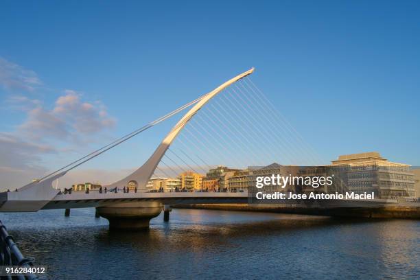 samuel beckett bridge, liffey river, dublin - samuel beckett bridge stock pictures, royalty-free photos & images