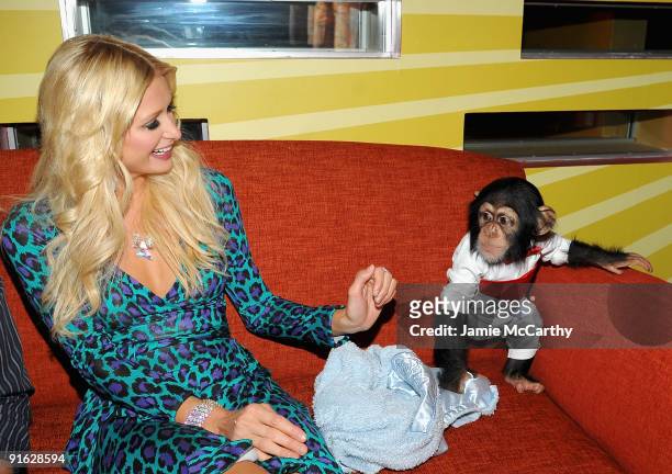 Paris Hilton with Bentley the Chimpanzee attends the opening of Carnival at Bowlmor Lanes on October 8, 2009 in New York City.