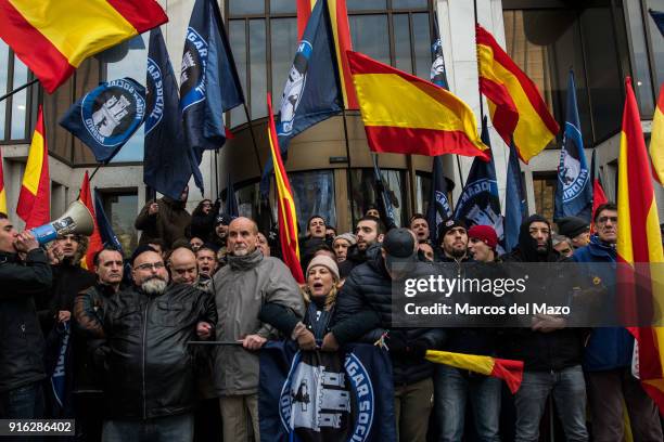 Supporters of far right group Hogar Social Madrid blocking the entrance of their occupied building as police arrives for their eviction, which...