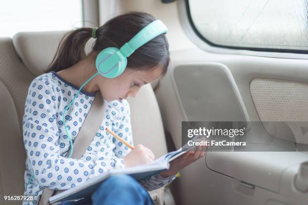 children in back seat on road trip - get out film 2017 stock pictures, royalty-free photos & images