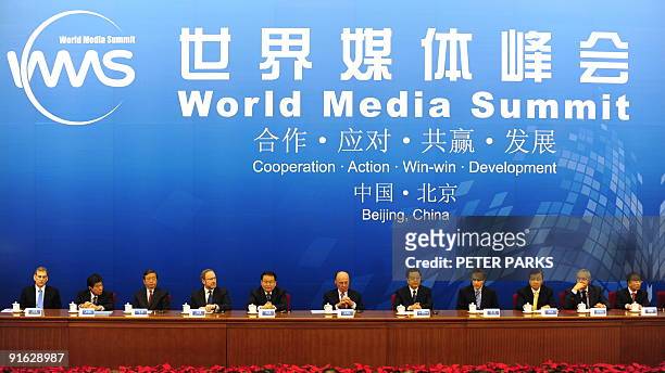 Leaders including Chinese President Hu Jintao and media mogul Rupert Murdoch attend the opening ceremony of the World Media Summit in the Great Hall...