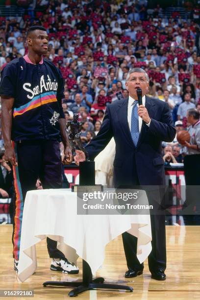 David Robinson of the San Antonio Spurs is presented the MVP Trophy by NBA Commissioner David Stern during Game Two of the Conference Finals of the...