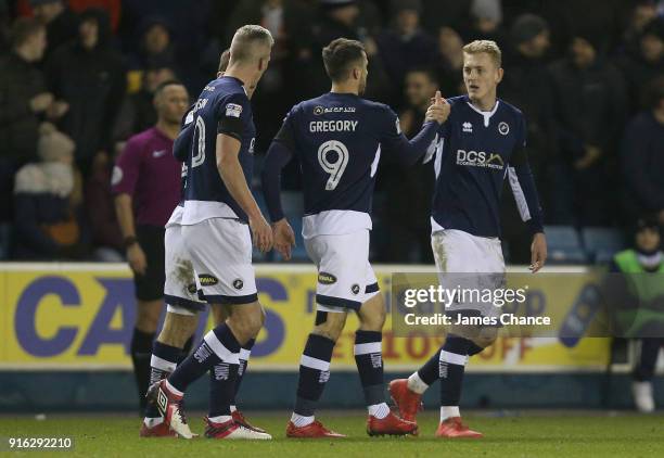 Lee Gregory of Millwall celebrates after scoring his sides first goal with his team mates during the Sky Bet Championship match between Millwall and...